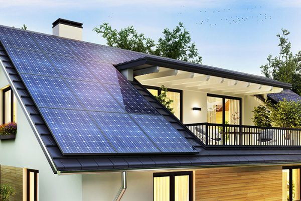 Solar panels on the gable roof of a beautiful modern home Solar panels on the gable roof of a beautiful modern home